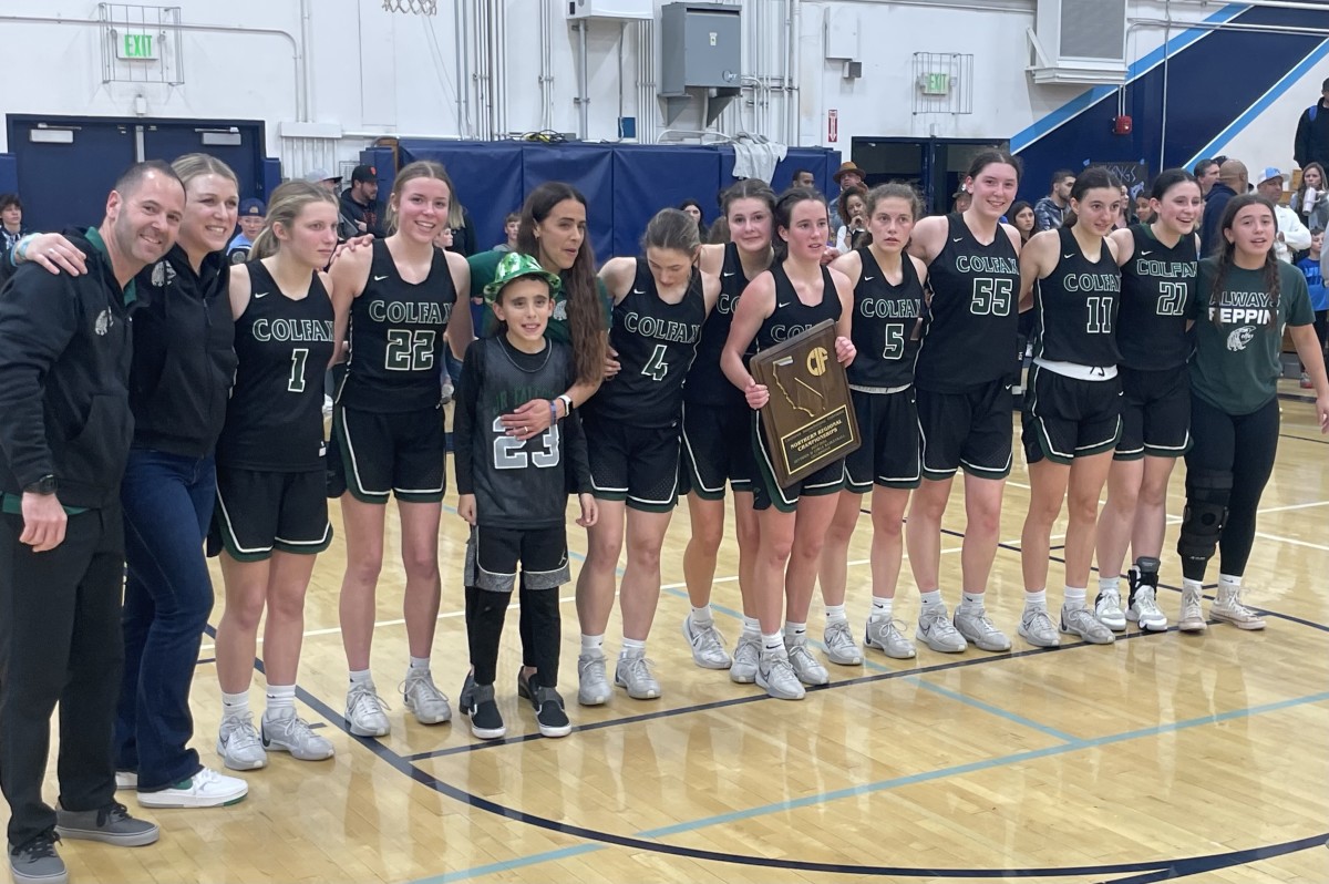 Colfax poses after winning their second straight regional title, this one 52-48 at Pleasant Valley on Tuesday.